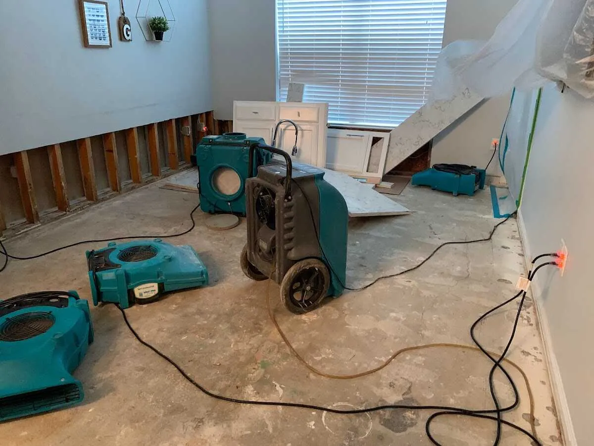 Dehumidifier in flood-cut room for Water Damage Restoration in Islip